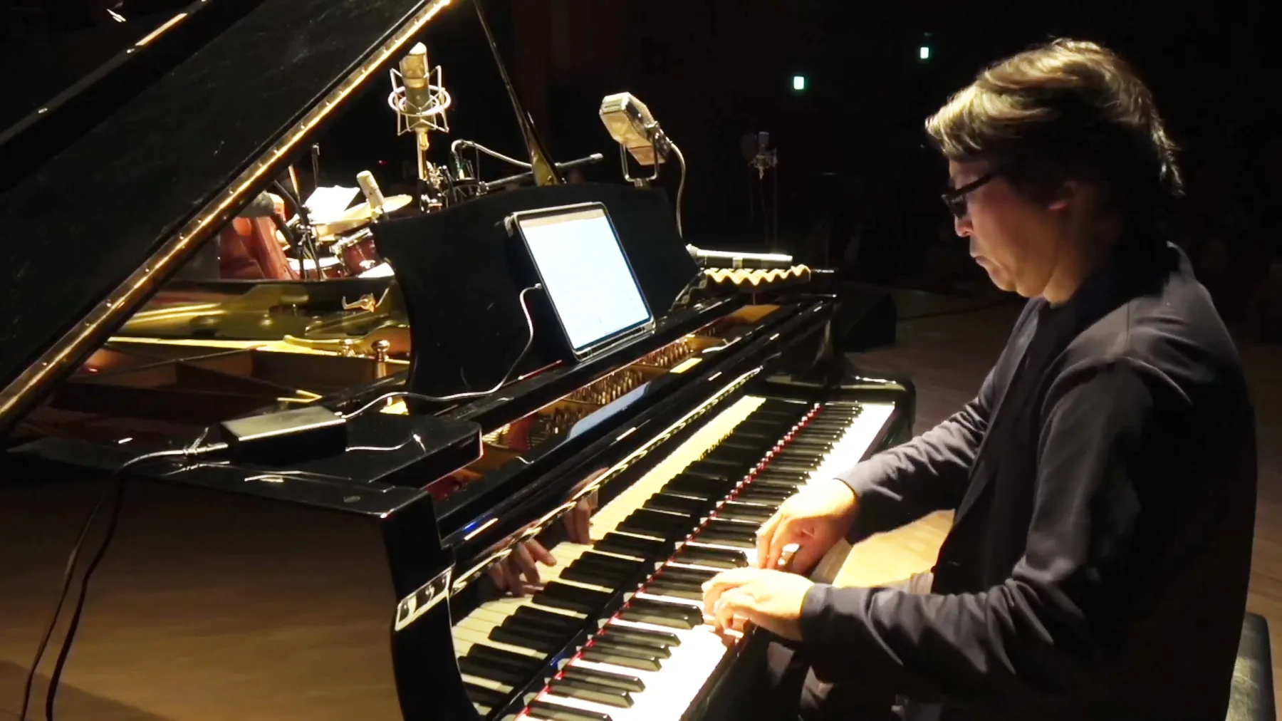 Concert pianist performing at a grand piano Concert pianist performing at a grand piano