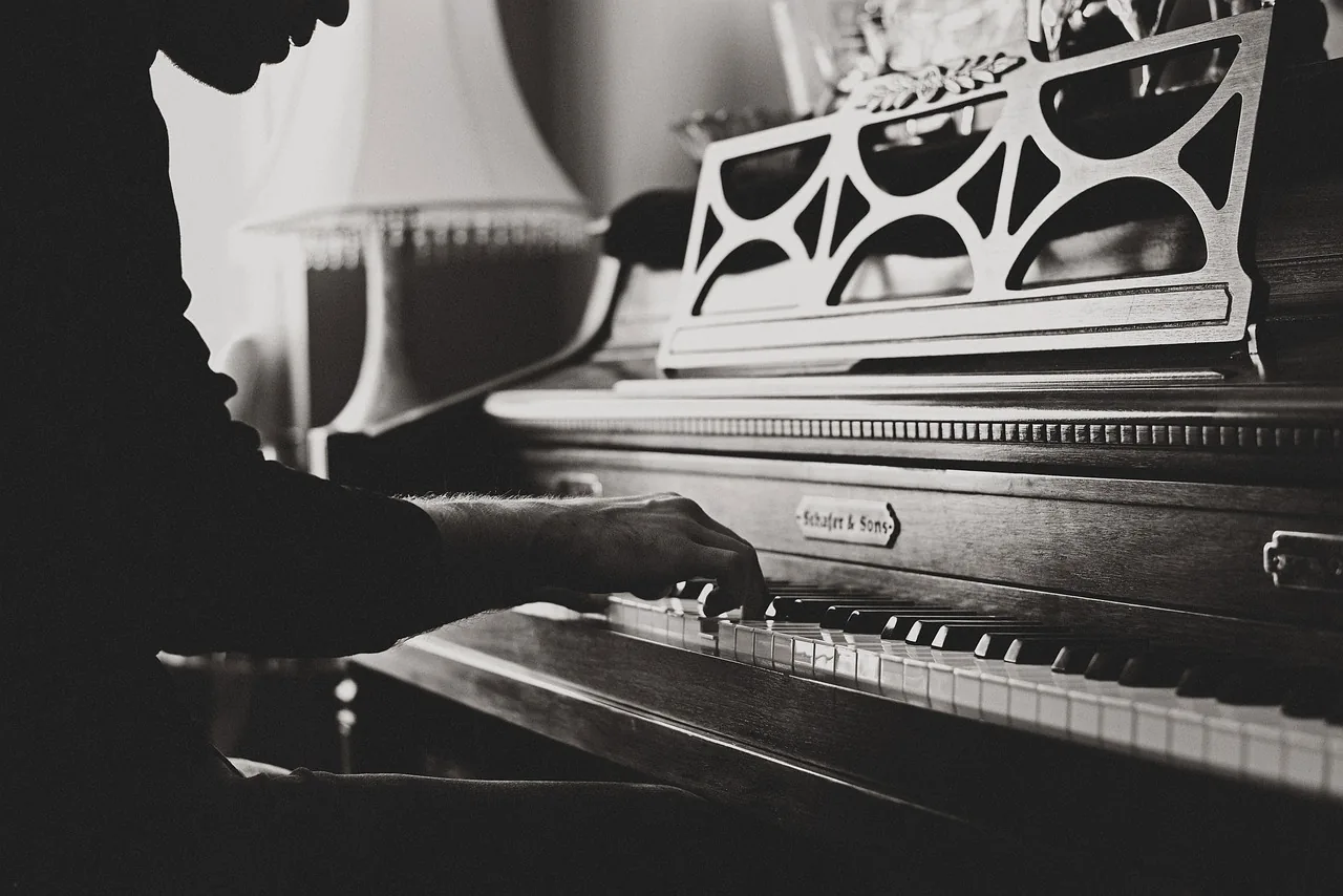 Classical pianist playing an antique piano Classical pianist playing an antique piano