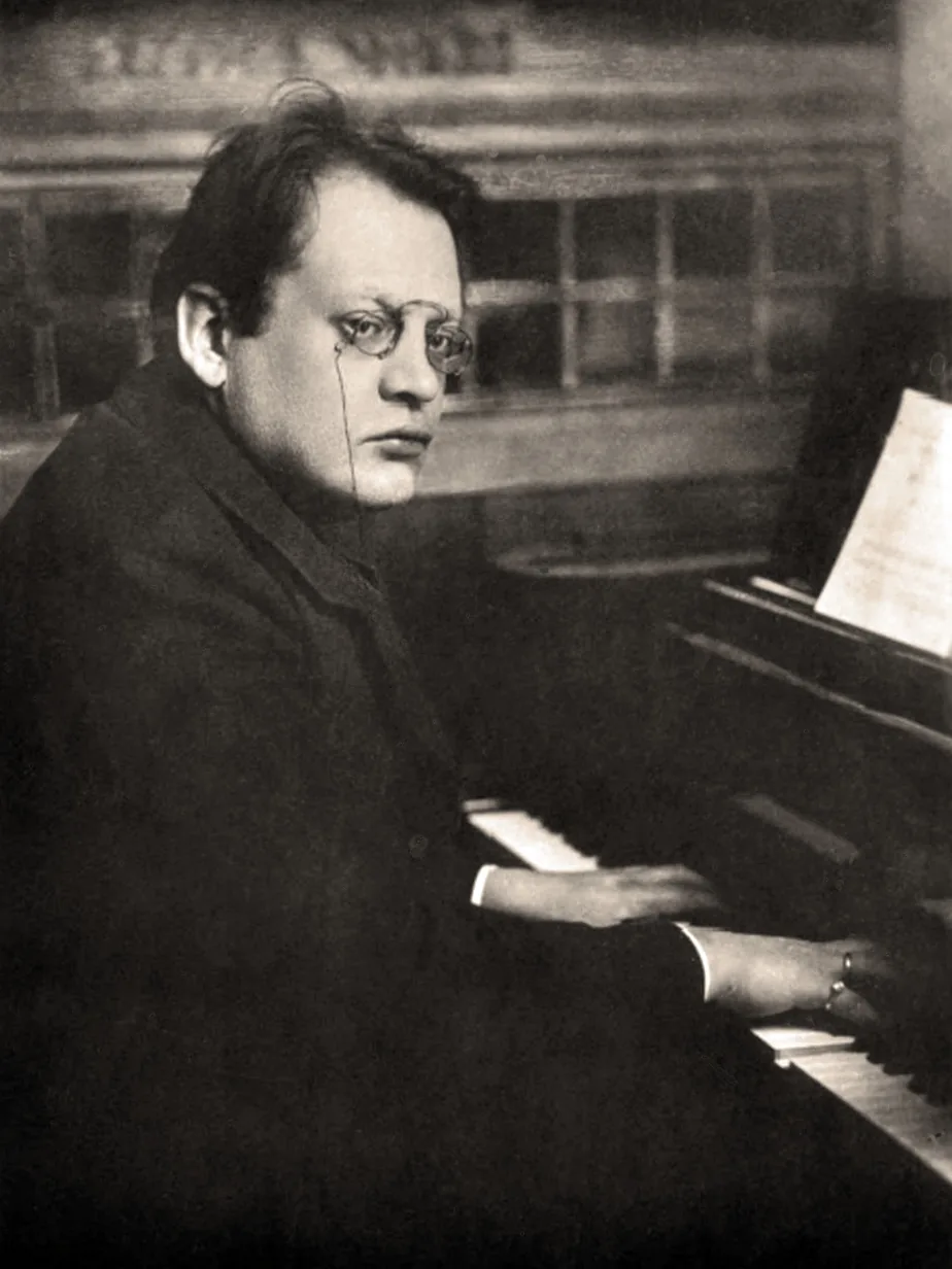 Pianist studying sheet music at the piano Pianist studying sheet music at the piano