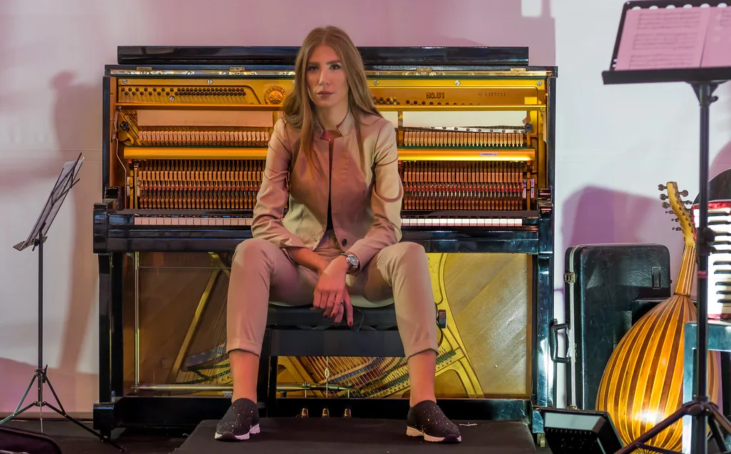 Female musician at an upright piano Female musician at an upright piano