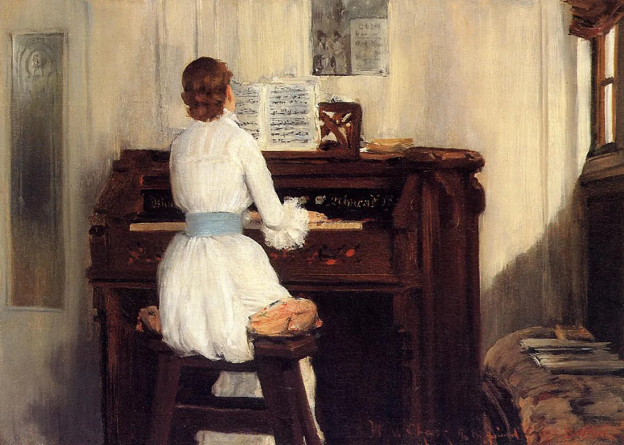 Pianist playing an upright piano Pianist playing an upright piano
