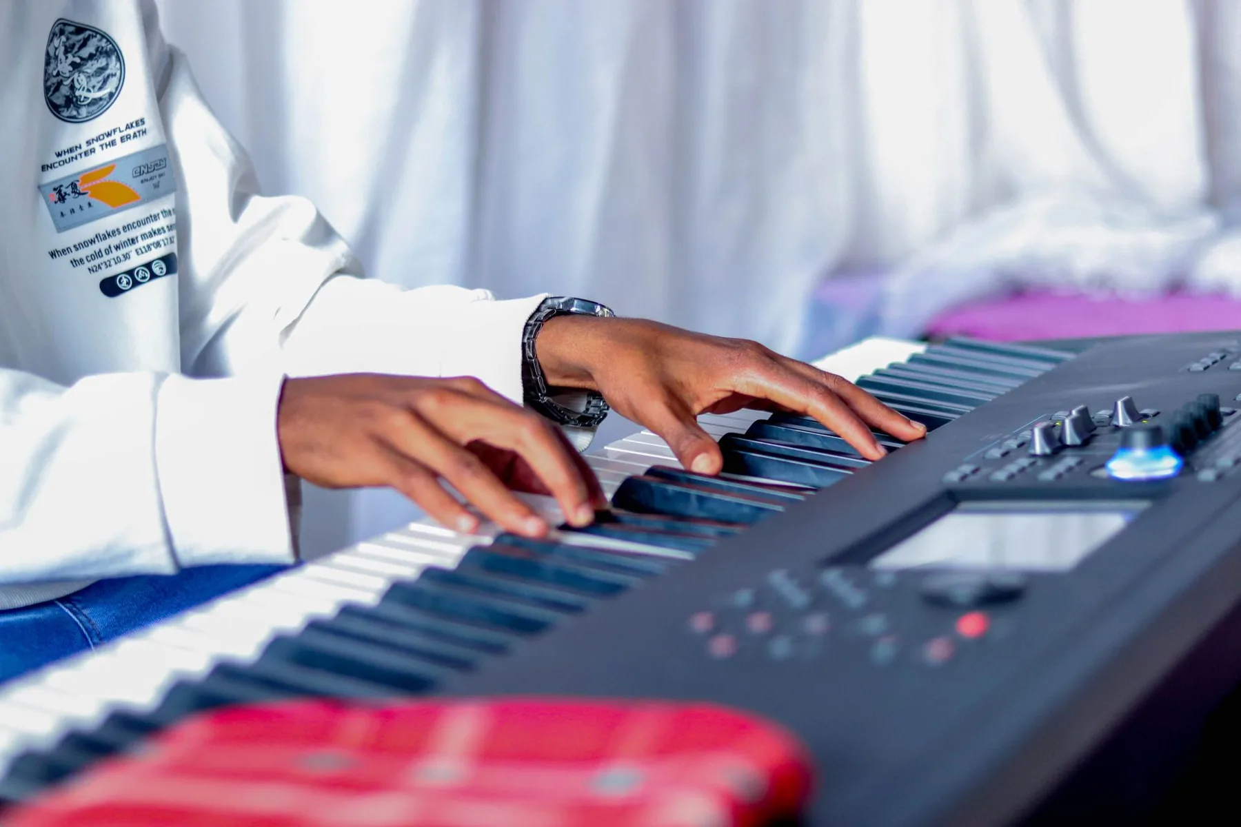 Musician playing a digital piano Musician playing a digital piano