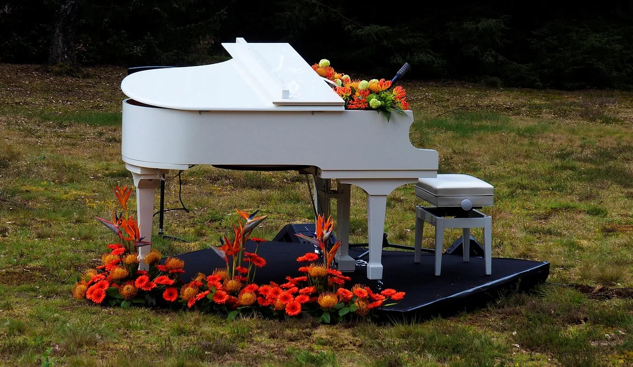 White grand piano outdoors
