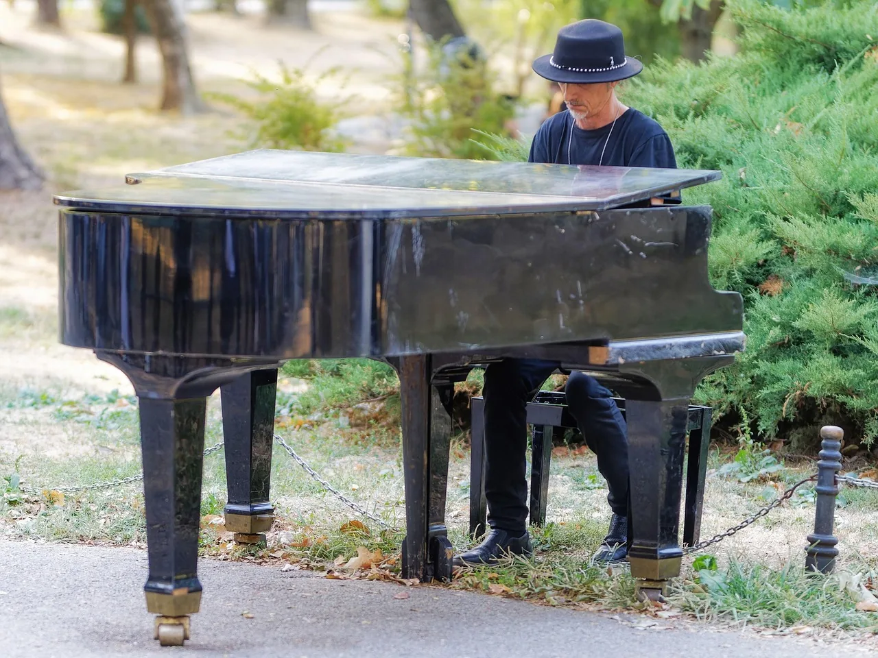 Pianist playing a grand piano Pianist playing a grand piano