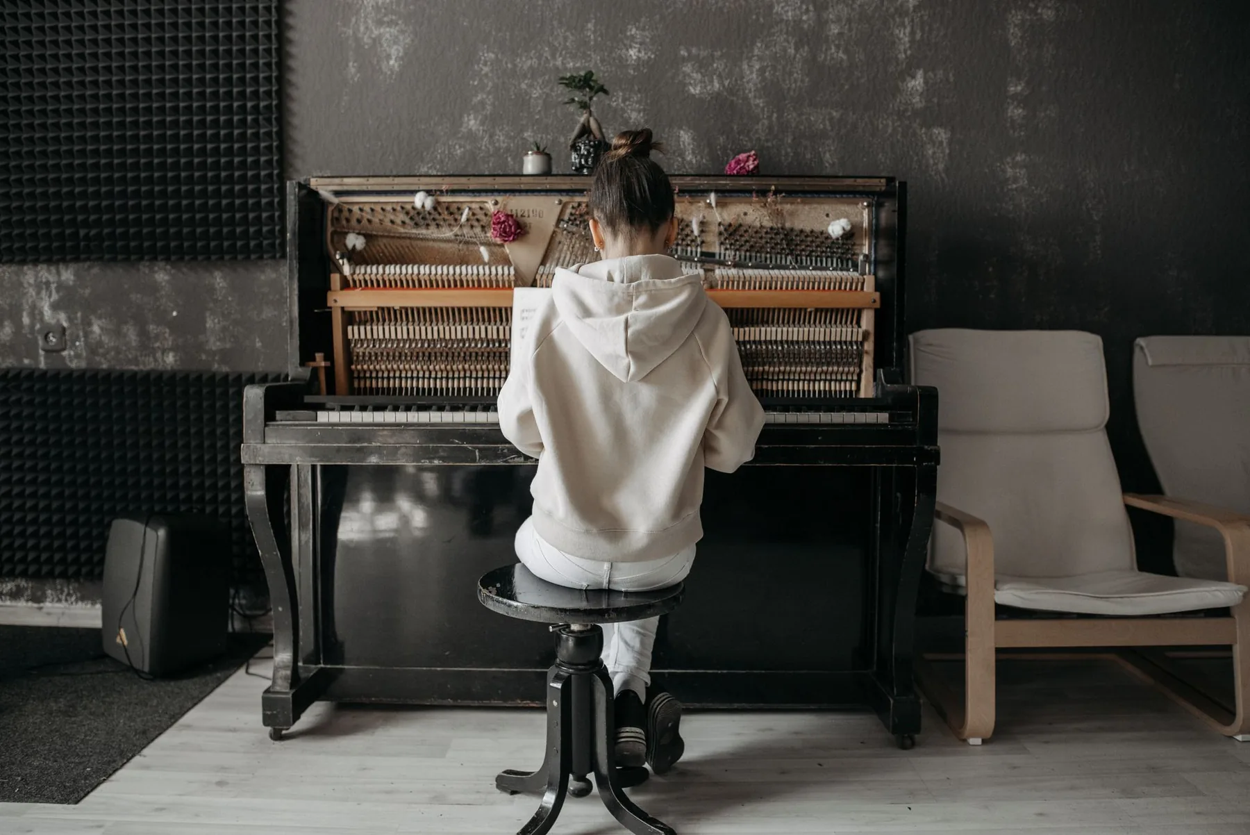 Pianist playing an upright piano Pianist playing an upright piano