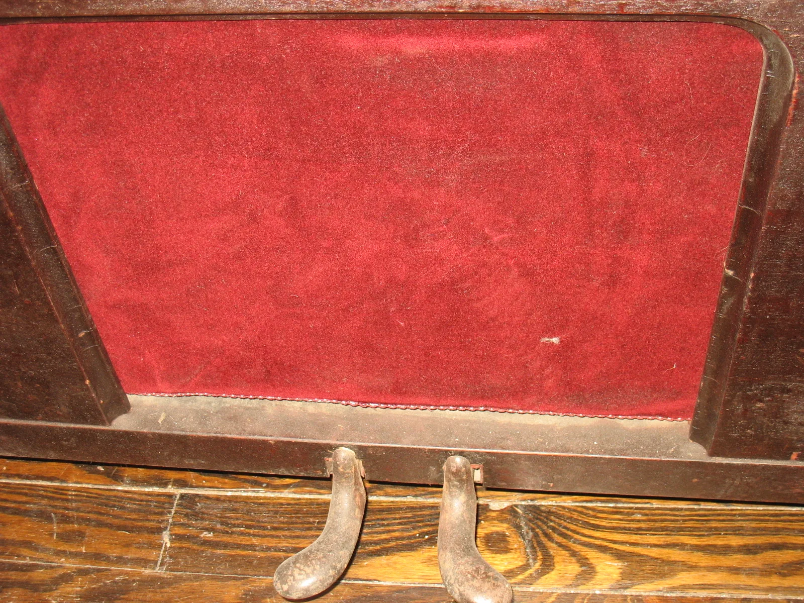Antique pedals beneath a piano Antique pedals beneath a piano