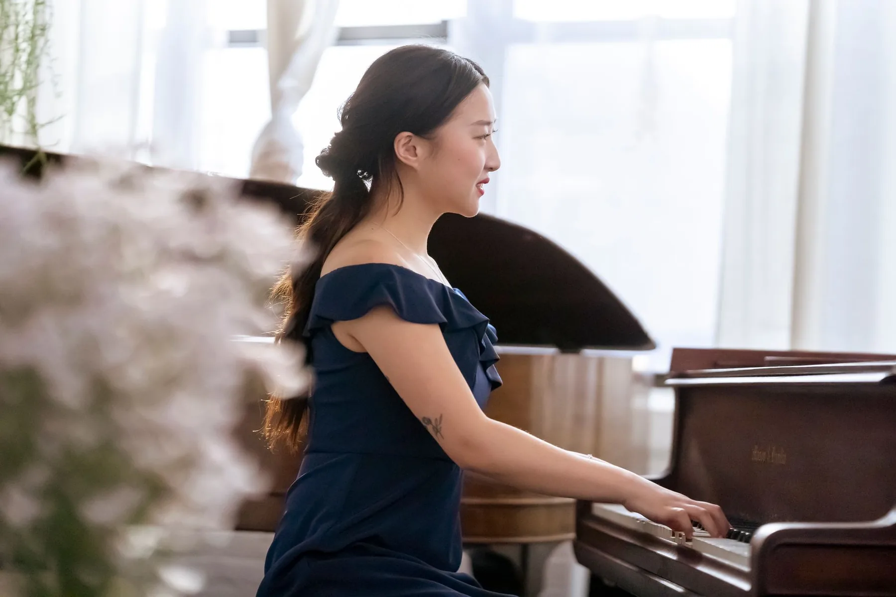 Pianist playing a grand piano Pianist playing a grand piano