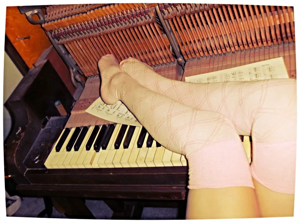 Discouraged student at her piano Discouraged student at her piano