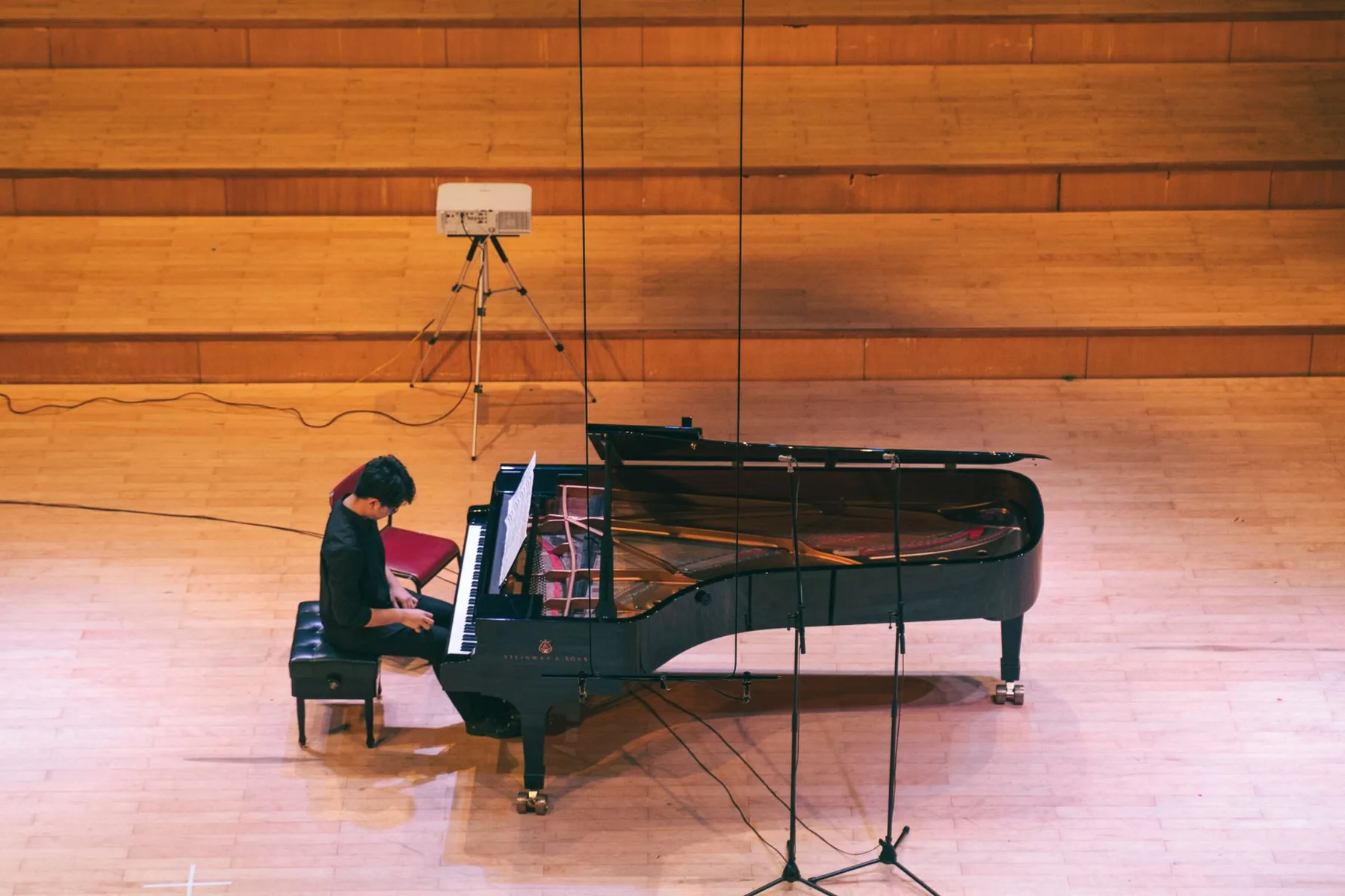 Pianist playing in a concert hall