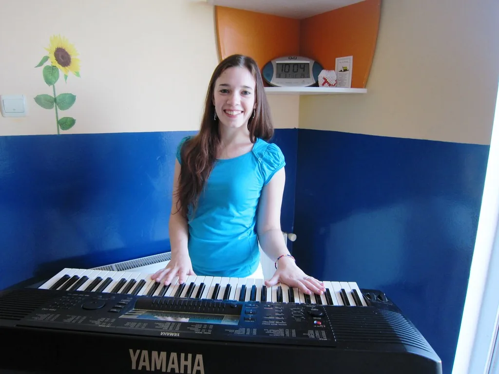 Musician at a black Yamaha piano