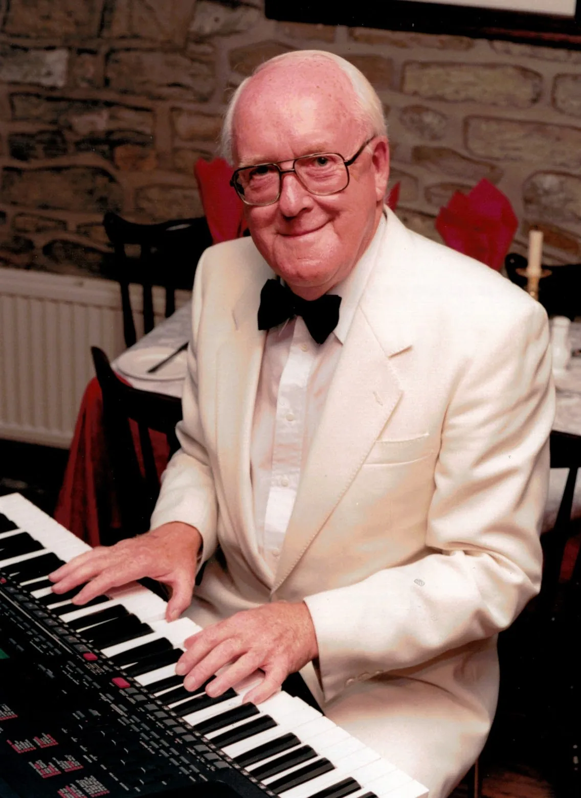 Musician playing an electronic piano Musician playing an electronic piano