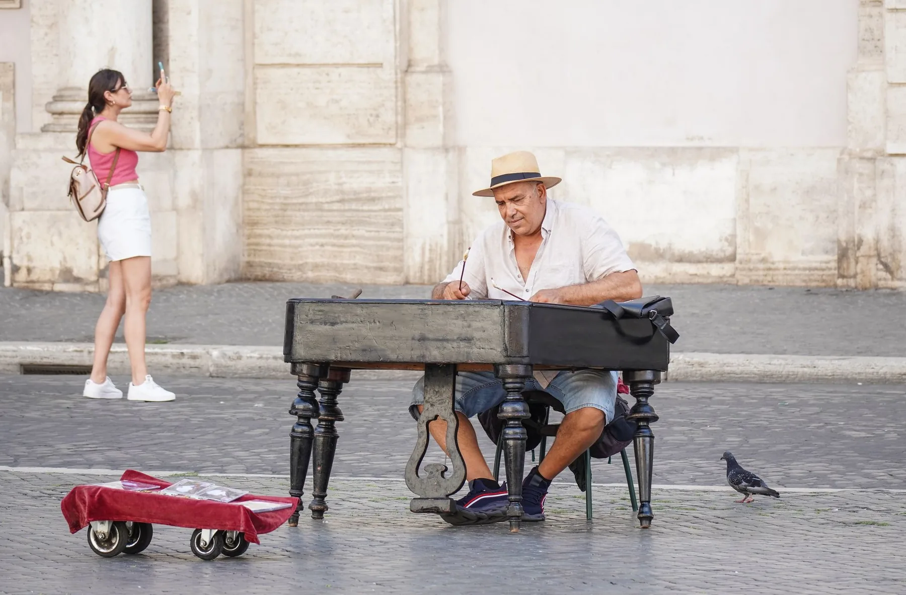 Musician playing piano in the street Musician playing piano in the street