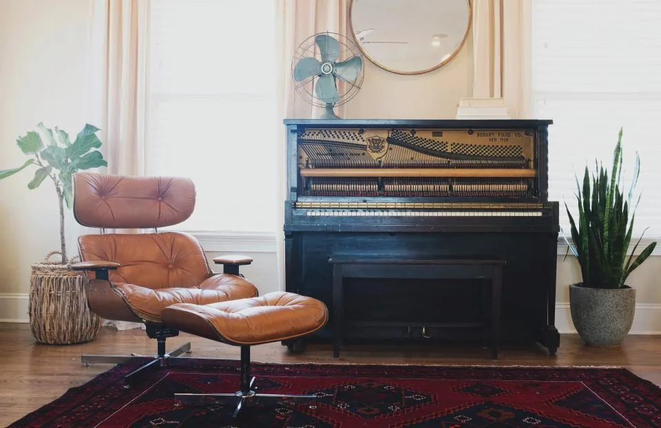 Upright piano in a bright living room Upright piano in a bright living room