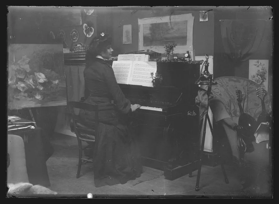Musician playing the piano at home Musician playing the piano at home