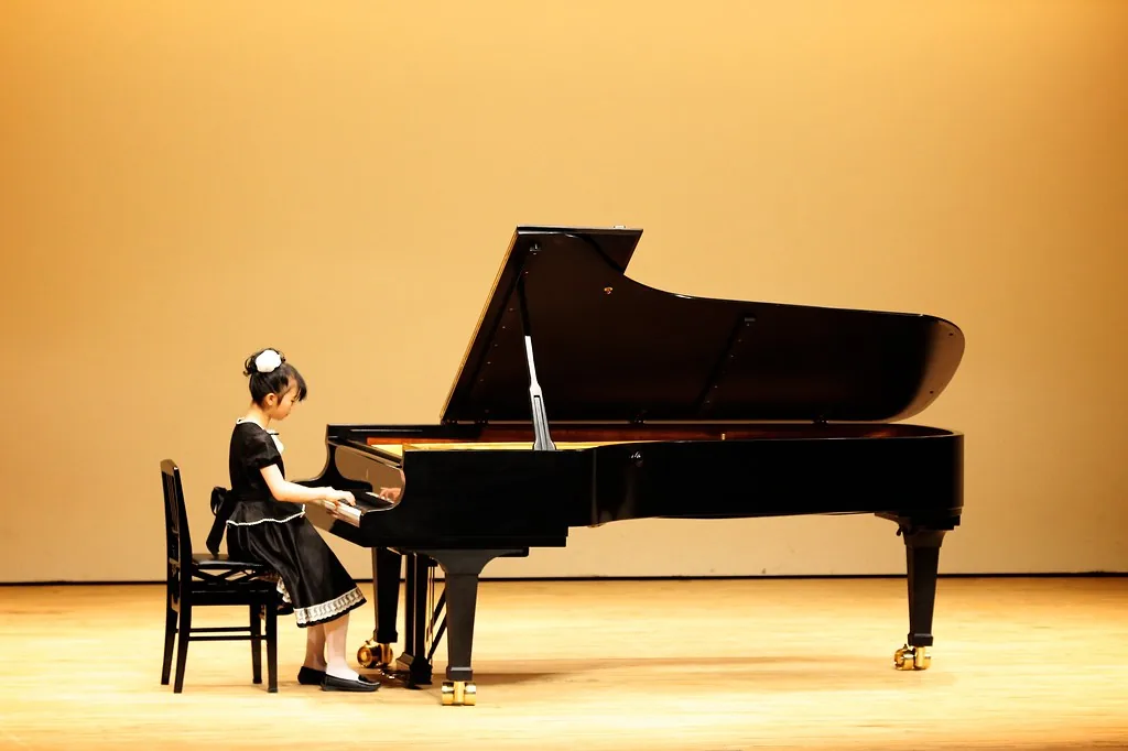 Young pianist at a grand piano