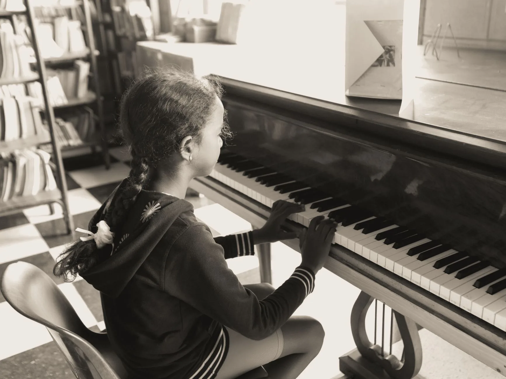 Young pianist during a learning session Young pianist during a learning session
