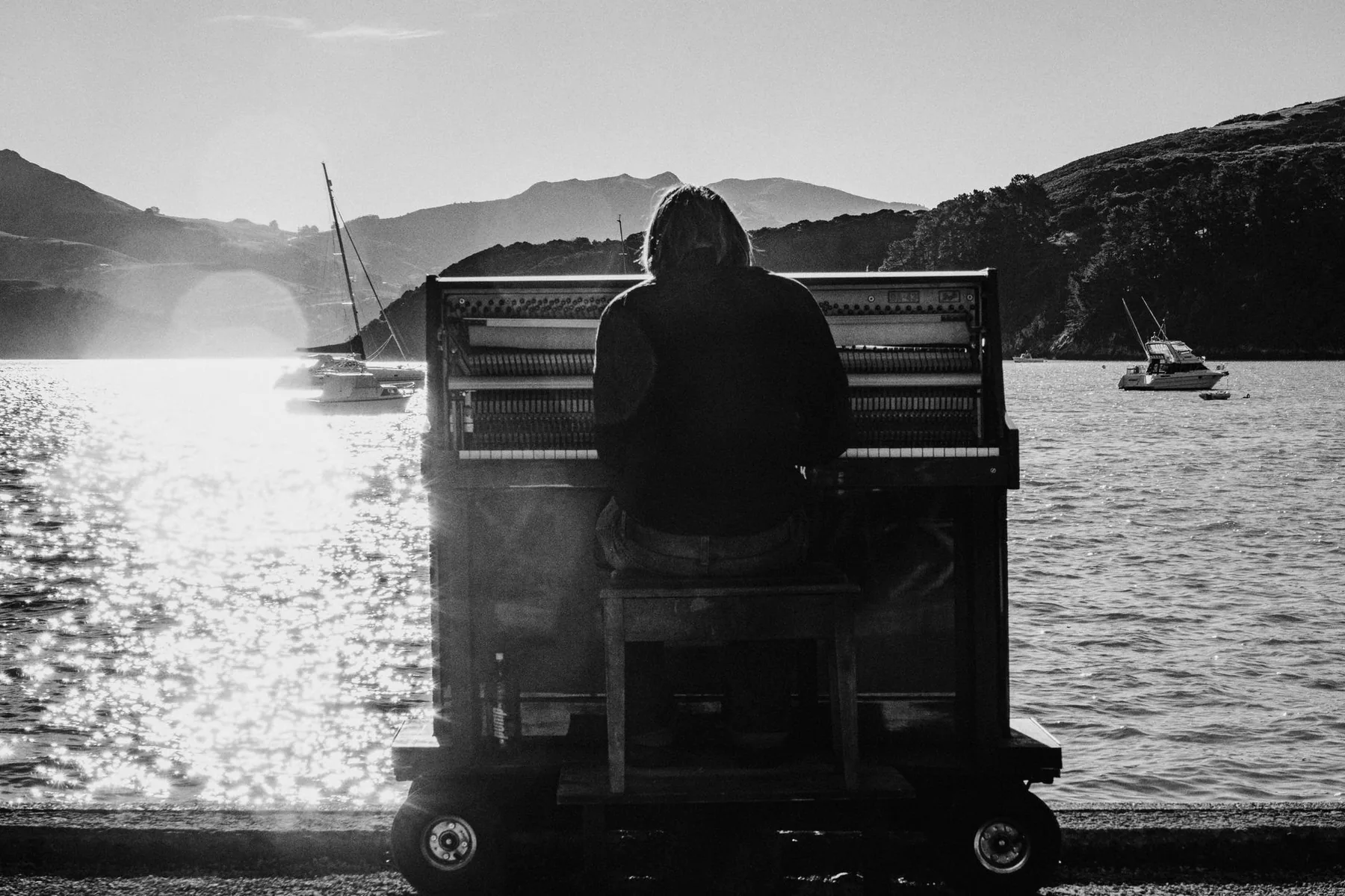 Musician at a piano by the sea Musician at a piano by the sea